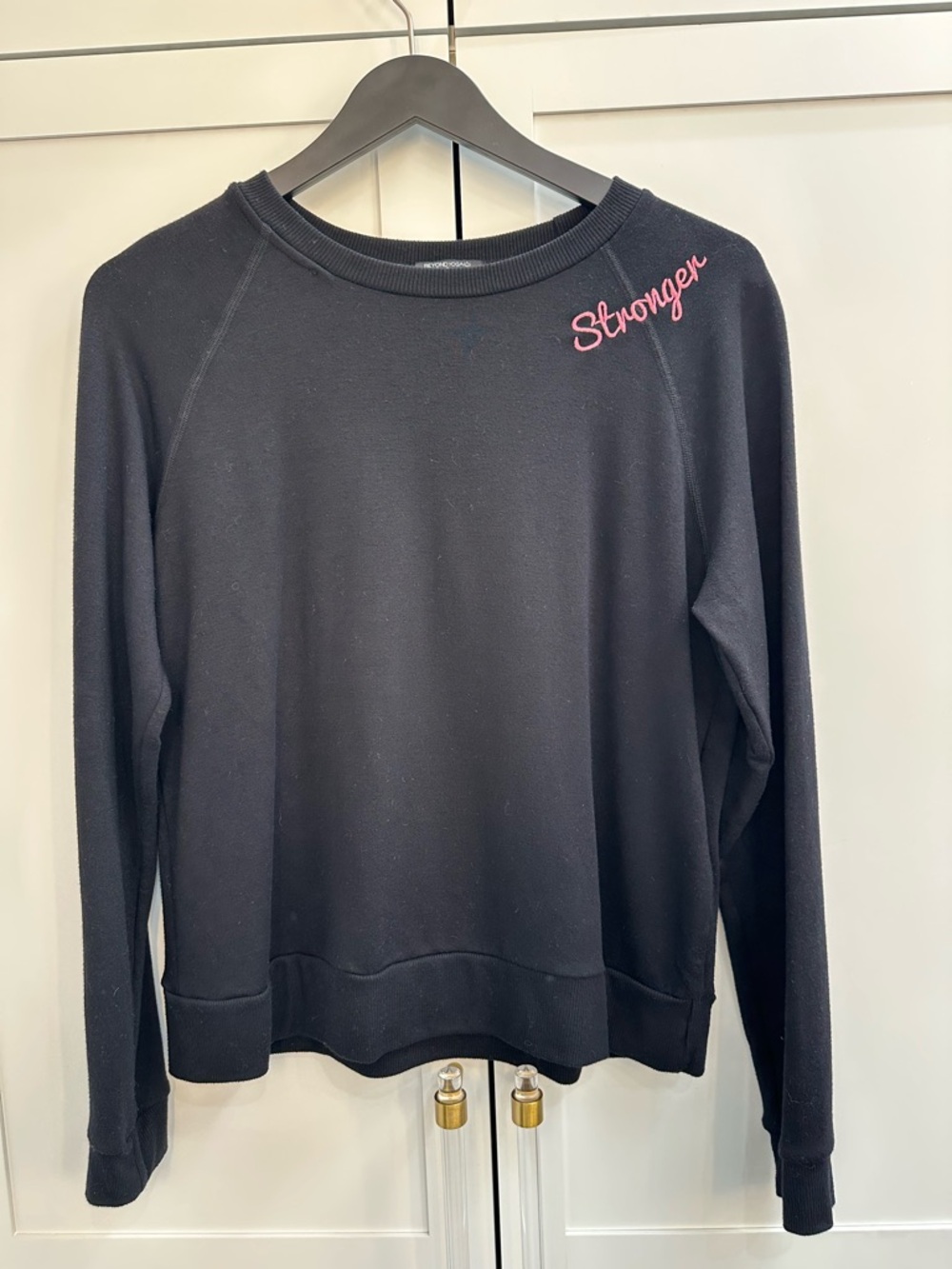 Peloton Black Crewneck Sweatshirt with Pink "Stronger" Embroidery